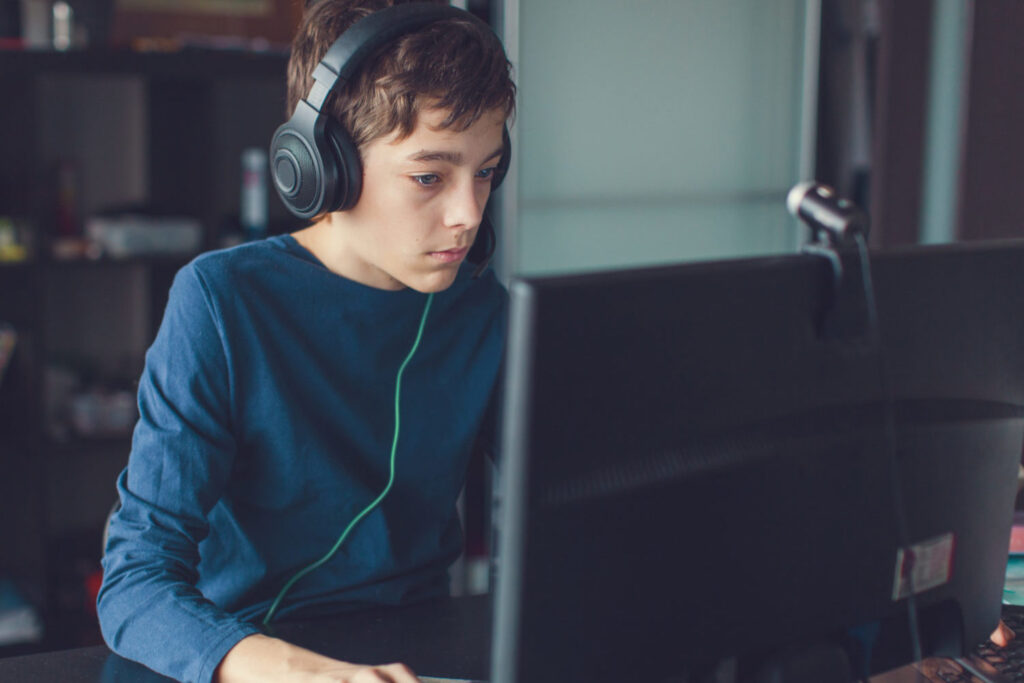 Teenager at computer SEN