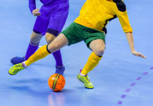 Football Futsal Ball and man Team. Indoor Soccer Sports Hall.